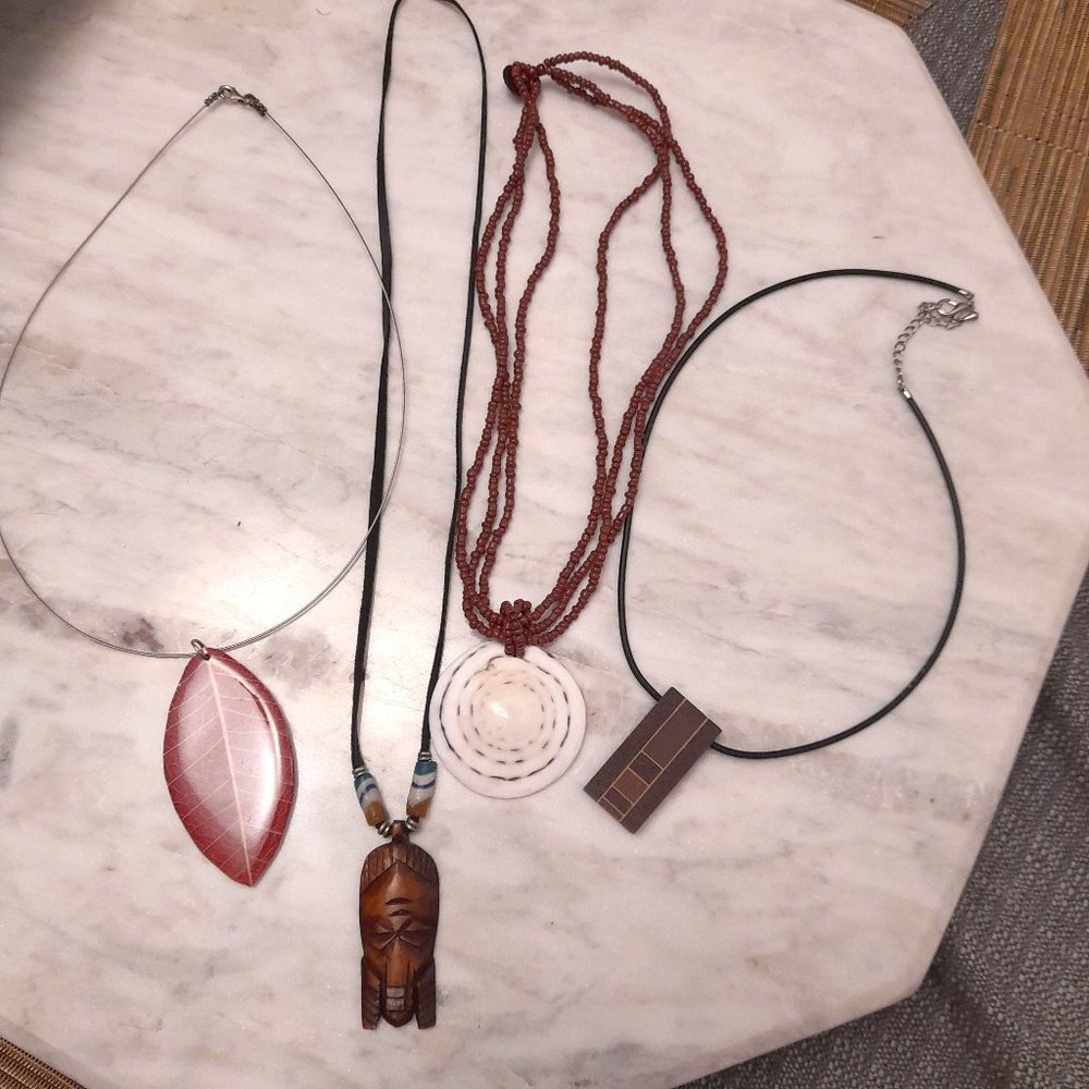4 Unique natural necklaces made of wood, shell, leather and coconuts.